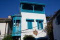 Beautiful narrow street in old town of Marmaris with plants and flowers on sunny day, Turkey. Blue balcony and door on Royalty Free Stock Photo