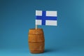 A beautiful national flag of finland on wooden stick in wooden barrel.