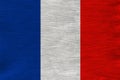 Beautiful national flag of France on soft silk with soft folds, close-up, copy space