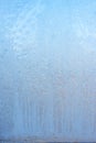 Beautiful natural background or texture of frozen transparent glass on the window in winter, extreme cold concept, vertical image Royalty Free Stock Photo