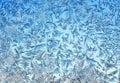 Beautiful natural blue textured background with frosty pattern on glass on a clear winter morning Royalty Free Stock Photo