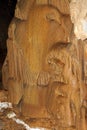 Beautiful natural cave with fox-coloured walls and formations of stalagmites and stalactites everywhere, natural texture image.