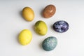 Beautiful natural colored happy easter eggs on white background Royalty Free Stock Photo