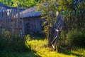 Dilapidated fence and house. Rustic dried wood. Royalty Free Stock Photo