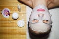 Beautiful natural girl woman in the spa salon, It makes a face mask