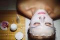 Beautiful natural girl woman in the spa salon, It makes a face mask Royalty Free Stock Photo