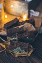 Beautiful natural handcrafted soap on wooden background with botanicals, close up. For relax, health, spa, aromatherapy