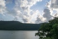 Beautiful natural landscape. Lake, blue sky with clouds. green forest