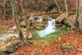 in a beautiful natural location in the autumn mountain forest small waterfalls Royalty Free Stock Photo