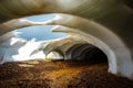 Beautiful natural phenomenon in Landmannalaugar, Iceland. Melting snow over the flowing river. Snow tunnel. Royalty Free Stock Photo