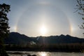 Beautiful Natural phenomenon Sun halo with cloud in the sky in the mountains. Royalty Free Stock Photo