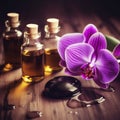 Beautiful natural pink orchid flowers, black massage stones and bottles of aromatic oil on the dark background of the spa salon Royalty Free Stock Photo