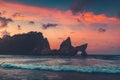 Beautiful Natural Rock Arch in Sunset Ocean Water