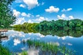 Panoramic view of valley of river lake. Peaceful summer landscape with green hills, beautiful woods, meadows, river lake Royalty Free Stock Photo