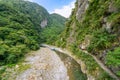Beautiful natural scenic of river inside the valley with green forest covered and a path way inside the hill Royalty Free Stock Photo