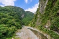 Beautiful natural scenic of river inside the valley with green forest covered and a path way inside the hill Royalty Free Stock Photo