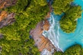 Aerial view Top down seashore Wave crashing on rock cliff