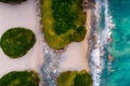 Aerial view Top down seashore big wave crashing on rock cliff