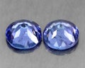 Beautiful natural tanzanite stone on gray background