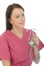Beautiful Natural Young Female Doctor Holding A Stethoscope Royalty Free Stock Photo