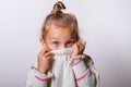 Beautiful natural young shy girl with smiling eyes wearing knitted sweater