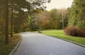 Beautiful Nature Autumn landscape. Scenery view on autumn city park with golden yellow foliage in cloudy day Royalty Free Stock Photo