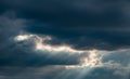 Beautiful nature background. Rays of sunlight through the clouds.