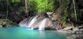 Beautiful nature background. Waterfall flows through forest