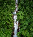 beautiful nature landscape krating waterfall and small photographer in the rainy season and refreshing greenery forest in the Royalty Free Stock Photo