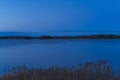 Beautiful nature and landscape photo of blue dusk evening at lake in Sweden Scandinavia Royalty Free Stock Photo