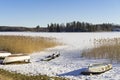 Beautiful nature and landscape photo of lake with ice and boats in Sweden Scandinavia Royalty Free Stock Photo