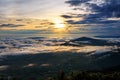 Beautiful nature landscape the sun is above the sea fog that covers the mountains and bright sky during sunrise in the winter at Royalty Free Stock Photo