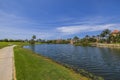 Beautiful nature landscape view. Blue pond water surface on blue sky with rear white clouds background. Royalty Free Stock Photo