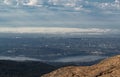 Beautiful Nature Landscape View from the Mountain Top and Downtown City in the Background during a summer sunrise Royalty Free Stock Photo