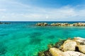 Beautiful nature landscape view. Rocky coast line.  Blue water surface of Atlantic ocean merging with blue sky on Curacao island Royalty Free Stock Photo