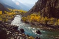 Winding river flowing along valley in Hindu Kush mountain range. Autumn season in Pakistan