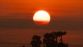 Beautiful nature morning with orange, yellow sunshine and fluffy clouds. Time lapse of a beautiful dramatic sky with a big sun at Royalty Free Stock Photo