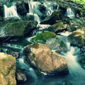 Beautiful nature with a river of rocks and forest. Outdoor colorful background with water. Royalty Free Stock Photo