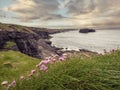 Beautiful nature scene with cliffs and ocean. Kilkee, county Clare, Ireland. Stunning Irish landscape. Dramatic cloudy sky Royalty Free Stock Photo