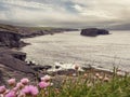 Beautiful nature scene with cliffs and ocean. Kilkee, county Clare, Ireland. Stunning Irish landscape. Dramatic cloudy sky Royalty Free Stock Photo