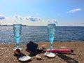 Beautiful nature vacation  romantic  summer  at sunset seascape two blue glasses of Champagne  living  coral blue white color wild Royalty Free Stock Photo