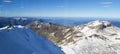 Beautiful nature White snow capped high mountains The surrounding area was full of blue. Below you can see a beautiful lake. Royalty Free Stock Photo