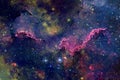 A beautiful nebula of different colors, with stars and galaxies. Elements of this image were furnished by NASA