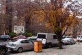 Beautiful Neighborhood Street during Autumn in Astoria Queens of New York City with a Colorful Tree