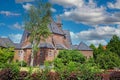 Beautiful neo gothic medieval St. Rochus church, green garden trees, now in use as Limburg archery museum - Steyl, Netherlands