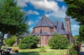 Beautiful neo gothic medieval St. Rochus church, green garden trees, now in use as Limburg archery museum - Steyl, Netherlands