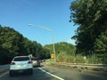 New Jersey Turnpike off ranmp at rush hour on Summer day. Lots of traffic.