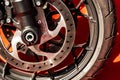 Beautiful, new motorcycle wheel on orange carpet Royalty Free Stock Photo