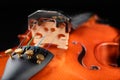 Beautiful new shiny violin on a dark table. Musical string instrument prepared for work Royalty Free Stock Photo