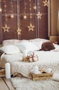 Beautiful New Year room decorations. Wall decorated with glowing stars